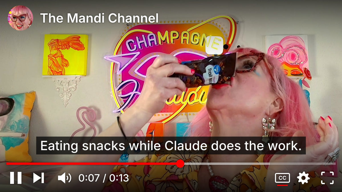 Mandi Loomis tipping a bag of trail mix straight into her mouth on The Mandi Channel, with the caption: Eating snacks while Claude does the work.